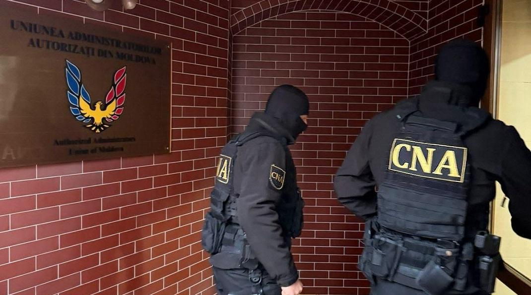 Percheziții într-un dosar de abuz în serviciu legat de un bloc locativ din Chișinău